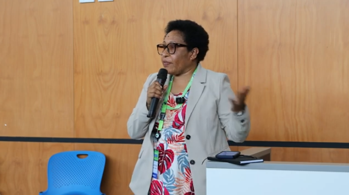 Legal Manager Valentina Kaman presenting on women beneficiaries in the project impacted areas